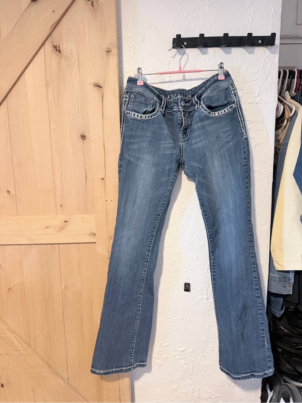 Kenya- Women's Blue Embellished Waistband Flare Jeans. They fit like a 13/31
